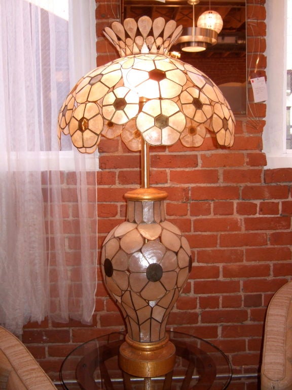 Large mid century modern capiz shell lamp.  Beautiful brass details, lamp sits on a golden wooden base.  This lamp is sure to make an impact in any room!<br />
<br />
Please visit our gallery in Stamford, Connecticut located at 583 Pacific Street.