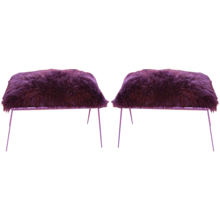PAIR of purple shearling ottomans