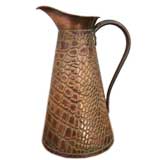 A Solid Copper Alligator Embossed Pitcher