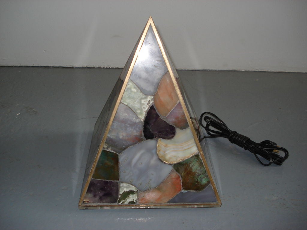 A unique table light compromised of sliced and pieced agate set in a bronze frame in the shape of a pyramid. Unattributed, but artist Willy Daro is a designer that used Agate in similar lamp designs.
