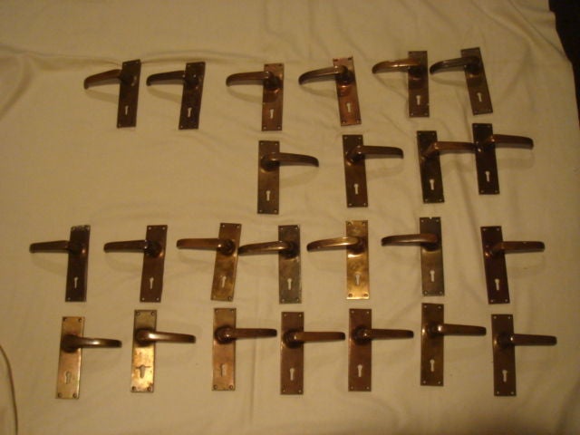 A set of twenty four vintage English Art Deco door handles /levers. Picture indicates right and left handles. Handle on a spring mechanism. Accepts a standard stem that works with a standard lock-set (not included)- Standard 2.25