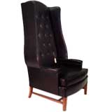 An Unusual High Back Tufted Wing Chair