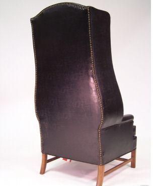 An Unusual High Back Tufted Wing Chair
