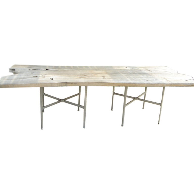 A long Free-form Ipe Wood Slab Table and Twelve chairs