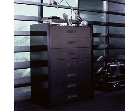A carbon fiber chest with drawers suspended in a black lacquer frame is detailed with blackened steel latches by Ralph Lauren. Retails for $29, 500