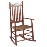 An Early American Bannister Back Rocking Chair