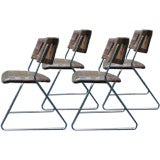 A Set of Four (4) Unique Woven Leather Chairs on Chrome bases.