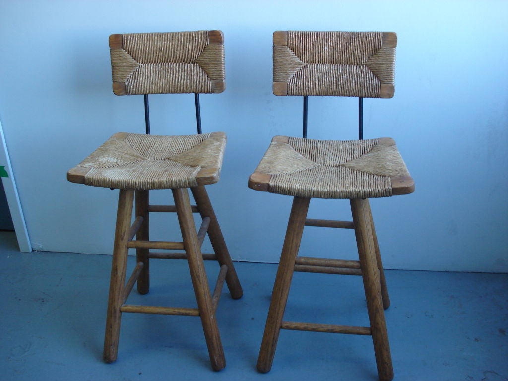 A Pair of Barstools in the manner of Charlotte Perriand