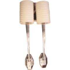 A Pair of Ruhlmann Style sconces in Polished Nickel Silver