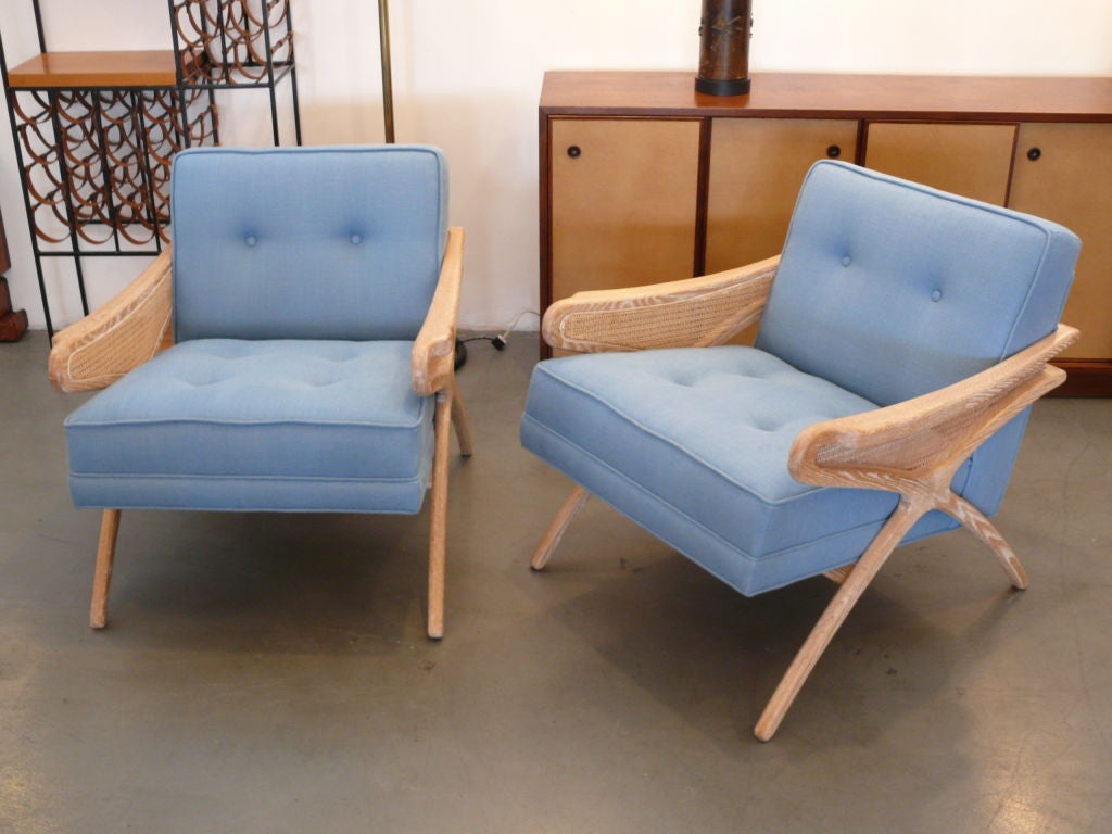 Pair of newly produced chairs in cerused oak and upholstered in ocean blue linen. <br />
Great design with caned detailing.   Multiple quantity available and can be upholstered in C.O.M.