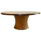 A BALINESE STYLE CIRCULAR PEDESTAL DINING TABLE