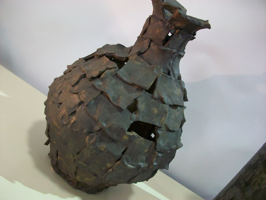 Brutalist vase/vessel by Judy DeHart consisting of over lapping linen surfaced slabs.***Contact/Shipping Information: AOL (American Online) users may experience difficulties sending emails to us or receiving emails from us. If you have made an