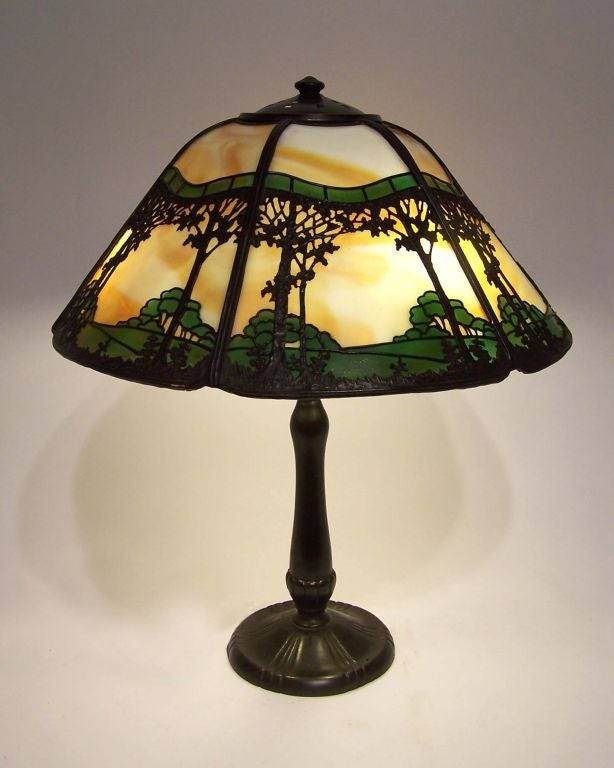 Arts & crafts lamp by Handel Lamp Co.  Beautiful arts & crafts scene with original shade, base, and lamp hardware (acorn shades, bryant sockets).  Shade marked.  ***Contact/Shipping Information: AOL (American Online) users may experience