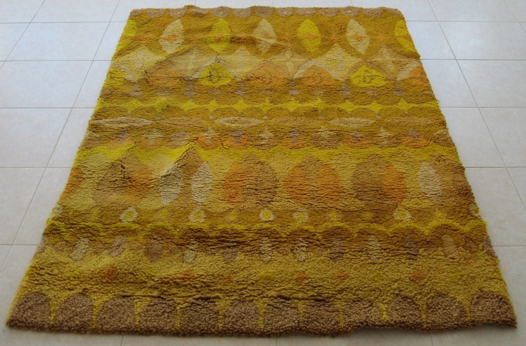 Fantastic signed Cynthia Sargent carpet designed in Mexico for Riggs/Sargent, dating to 1968.  100% wool loop pile woven on a cotton backing with latex overlay. Colors are in the golden/yellow family. Rare item from one of the mid century's best and