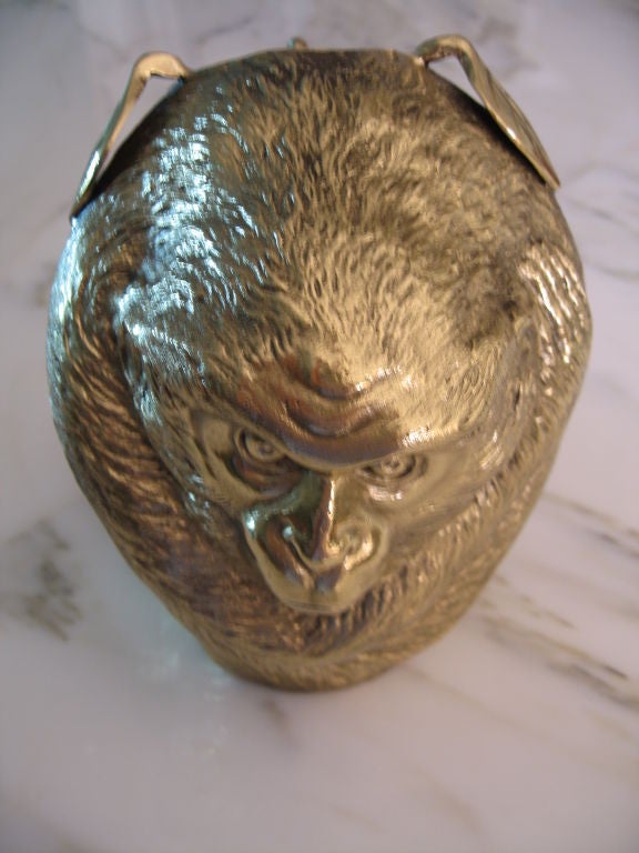 Finely chased and detailed bronze monkey vase dating to the 1920's.<br />
Designed as a monkey, balled up in the shape of an orange, with leaves protruding out it's back. Smaller vase opeining on top. Small tail noted. Recently polished and