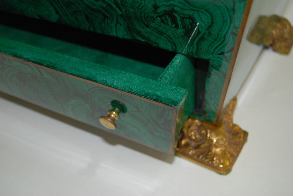 A wonderful and substantial signed Maitland Smith faux malachite box/chest bearing its original finish and brass feet.