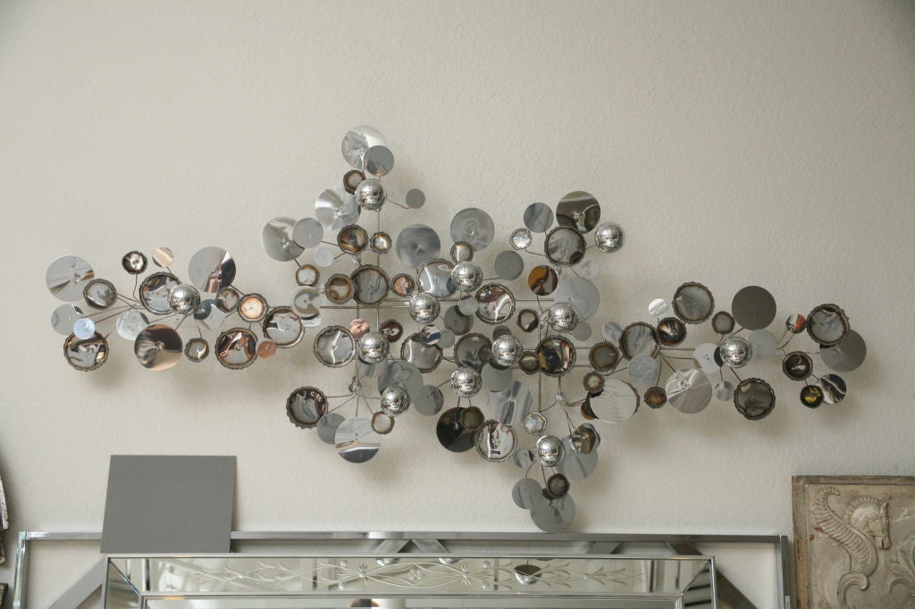 The largest version of the now-iconic Curtis Jere wall sculpture, this chrome 