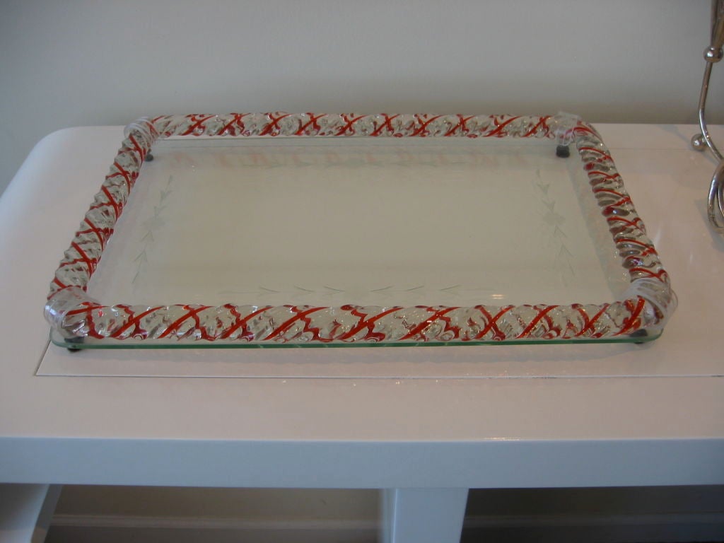 Venini tray with etched glass bottom and ribbed tubular border with red X pattern. Four lucite bands-one on each corner. Rests on four tiny feet. Has a Venetian feel to the design and can be used as a fabulous serving tray and as a vanity tray for