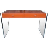 An Hermes Orange Lacquered Desk with Lucite
