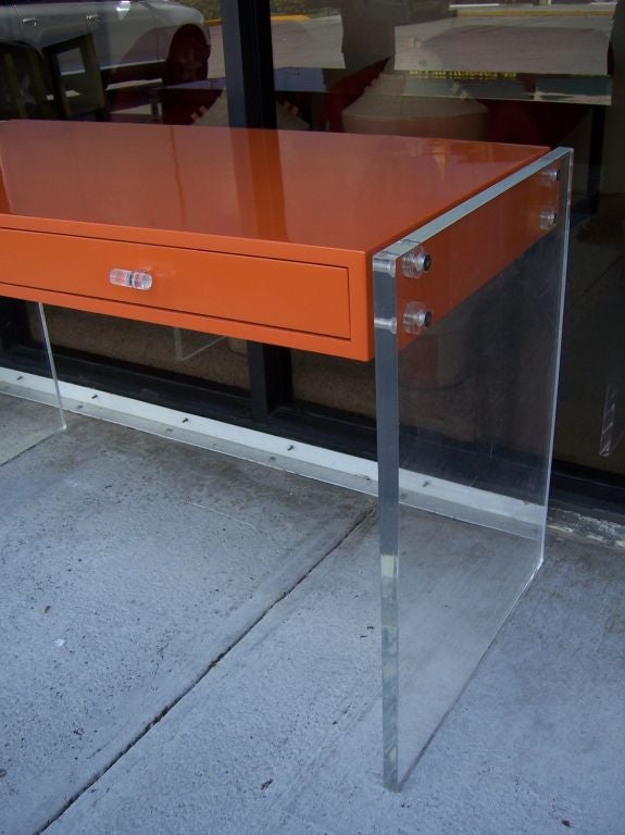 American An Hermes Orange Lacquered Desk with Lucite