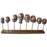 A Mounted Grouping of Copperized Doll Head Molds
