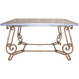 An Oversized Gilded Iron and Carrara Marble Garden Table