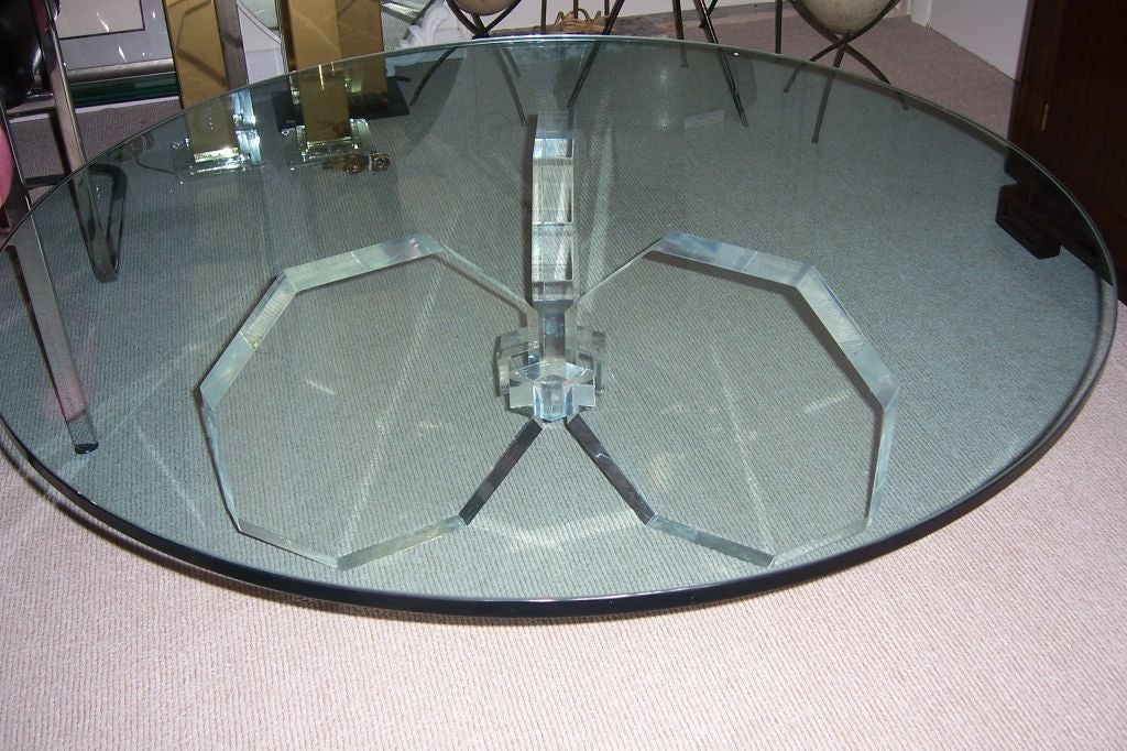 Three hexagonal shapes make up the base of this high polished lucite coffee table.  Thick glass top, original to the base.  Just stunning!