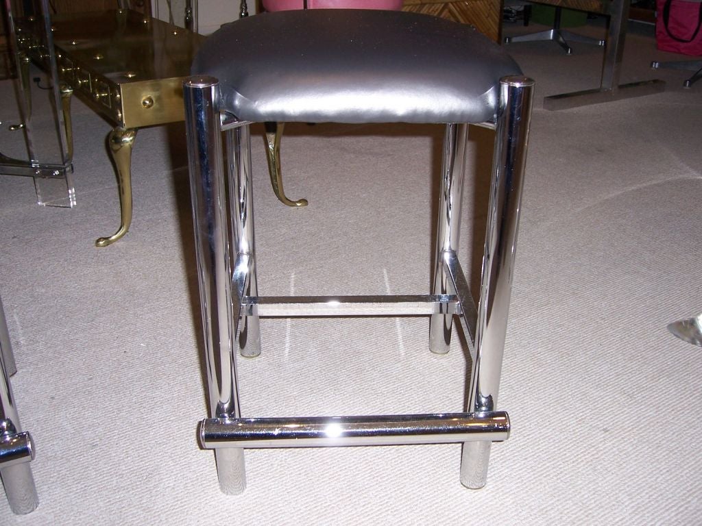Great pair of low barstools in chrome frame and new charcoal colored vinyl upholstery.  Solid frame and comfortable height.

This item is currently in our MIAMI facility. Please call or email us directly for details.