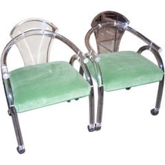 A Set of Four Lucite Game Table Armchairs on Casters