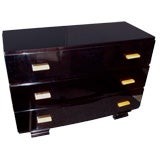 A Three Drawer Art Deco Commode in Black Lacquer