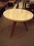 A Round Art Deco Occasional Table with a Parchment Top