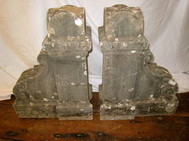 This pair of 19th century French corbels can be used as is in the garden as decorative ornaments. They can also be used as the base to a console when mounted in a wall. This was their original use, projecting from within a wall supporting a weight