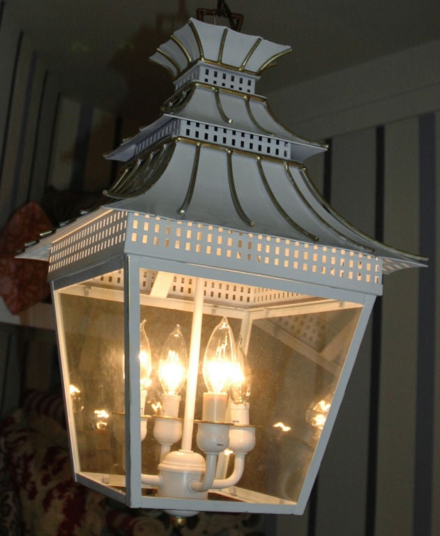 Vintage style pagoda lantern painted in a light cool steel grey with gold accents.<br />
Two available.