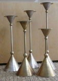 set of five metal candlesticks