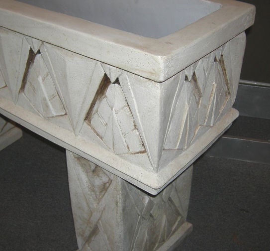This ultra stylized concrete planter originated from the San Francisco area in the 1930's. The architecturally embellished surfaces blended beautifully with the current moderne buildings of the period. The solid planter box sits atop the two legs,