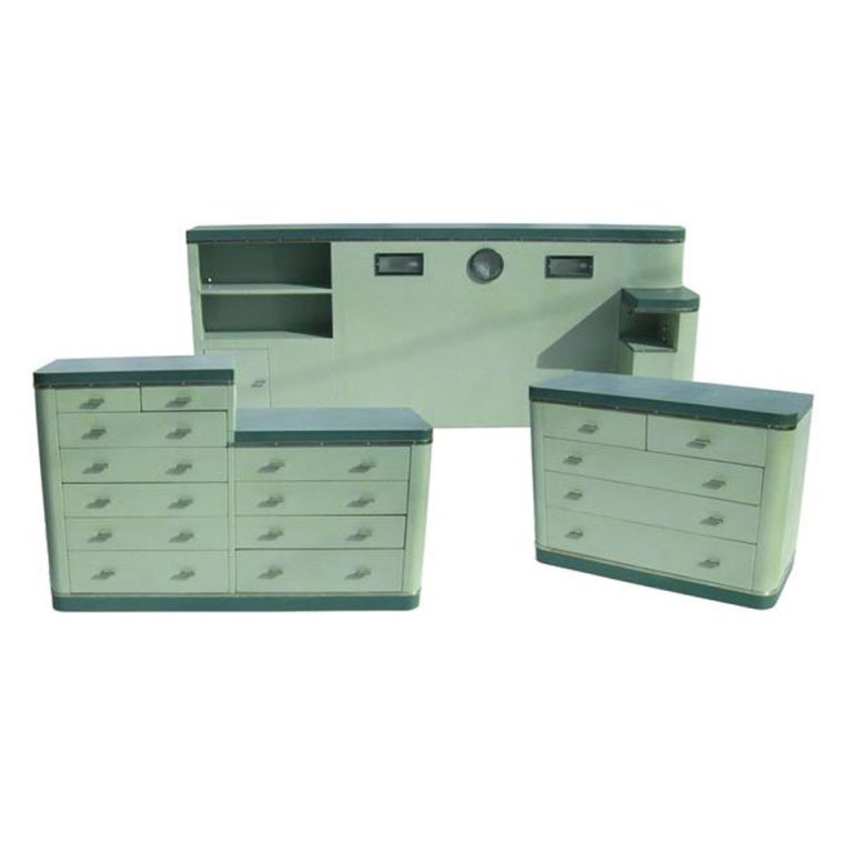 This great set was sold from our store ten years ago, and just found its' way back to us! The set was apparently used on an ocean liner, or an ocean liner movie set. There is a working radio and lights in the headboard, as shown. The three pieces