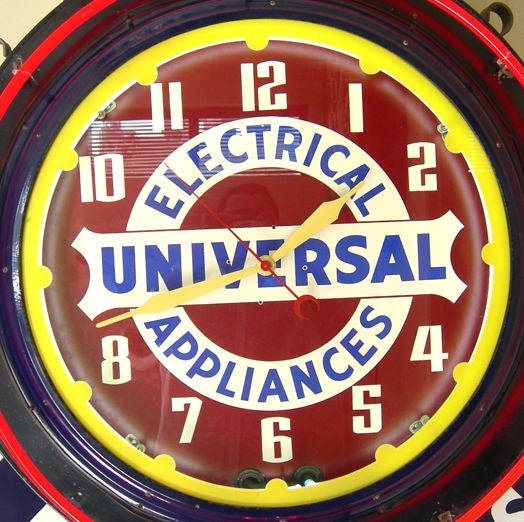 One of the most difficult items to find in the neon genre is a double faced clock. This magnificent example has porcelain enameled clock bezels, and a porcelain 