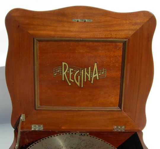 Before Itunes,CD's, cassettes,vinyl records, and even glass 78RPM records, there was the perforated metal disc. The crank was wound up, and the music flowed.... The perforations in the metal disc correspond to pins on the revolving cylinder, which