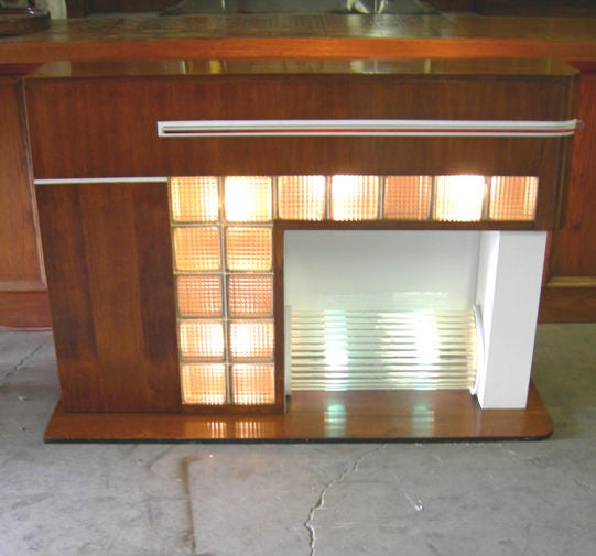 Want to add the romance of a glowing fireplace without tearing out the walls? Just slide this beauty in place, and light it up! The finished walnut cabinet adds a quality touch, and doubles as a hidden cabinet. Light glows through the glass blocks,