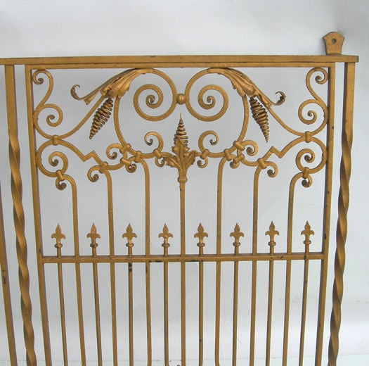 Whatever happened to quality craftsmanship? Nobody does beautiful, intricate ironwork like this anymore. The iron grate was from a small American bank in California in the early part of the century, and is still in fantastic original condition. The