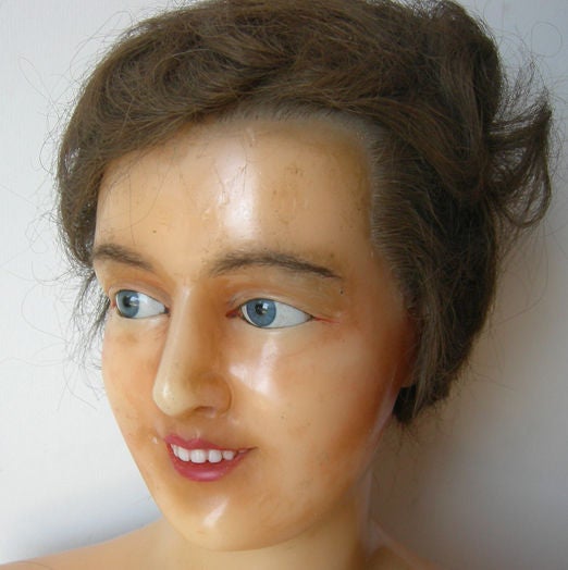 The very finest mannequins were the French wax versions, complete with glass eyes, porcelain teeth, and human hair. Ah, they don't make them like they used to... She displays very well, although there is some missing wax material on the back side,