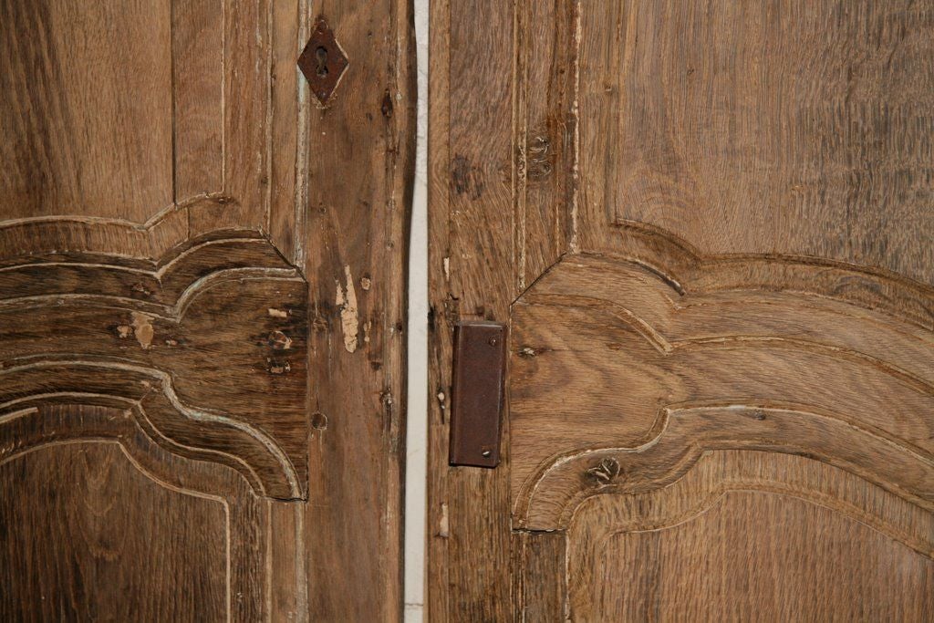 Pair of 18th century chestnut armoire doors.

Measures: 65.5'' H x 21'' W x 1'' D.