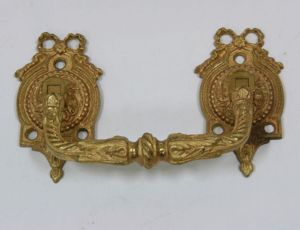 Pair of 19th century French bronze doré́ handles.
Measures: 6'' W x 3.5'' H x 1.5'' D.