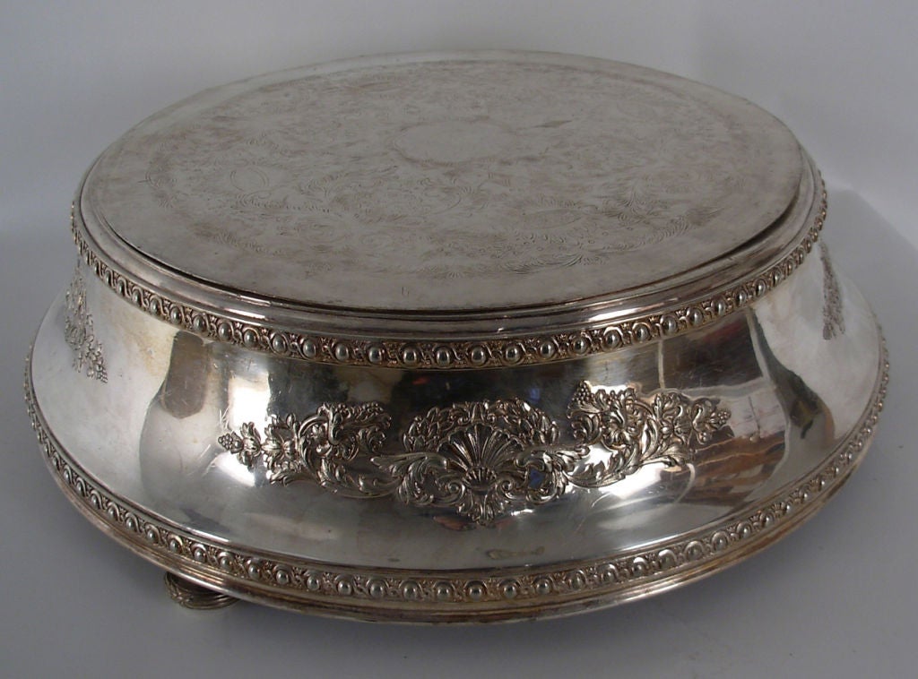Extremely large and grand silver plate plateau, most likely used to present a wedding cake. The top is not attached, so as to make moving the cake easier. Great show for entertaining.