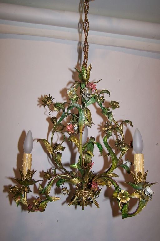 Small floral form painted metal chandelier. The height below is adjustable.