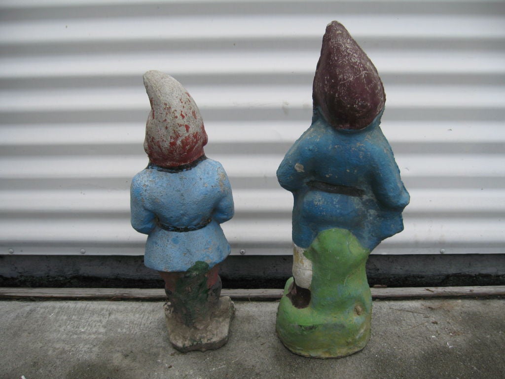 Pair of cement garden gnomes.