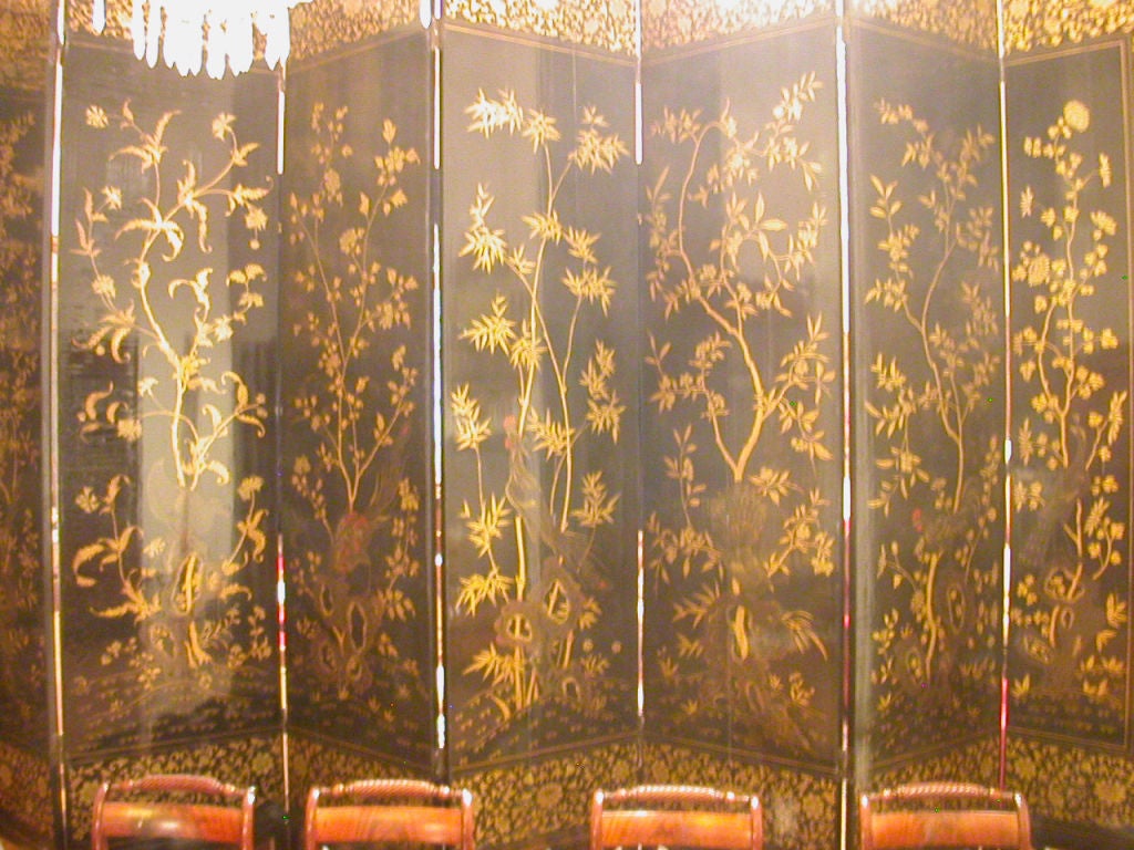 Chinese black and gilt lacquer eight panel screen