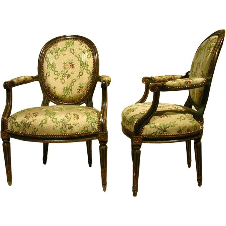 Pair Of French Louis XVI Painted And Gilt Fauteuils For Sale