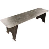 Steel patchwork riveted bench
