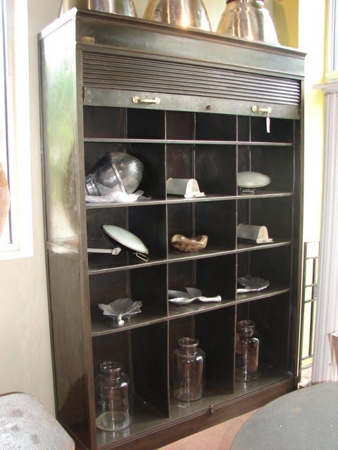 Steel tambour front bookcase